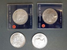 A cased 1935 George V 'rocking horse' crown together with two George VI 1937 Coronation examples