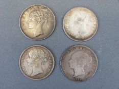 Four Victorian silver coins comprising three 1840 East India Company one Rupees and an 1874 half