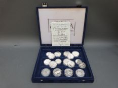 A case containing four silver 'Official Silver Coins of China' with certificates,