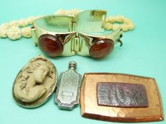 A lava cameo brooch, a white metal scent bottle, brooch,