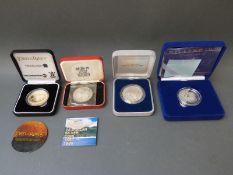 Four crown sized silver coins to include Lord of the Rings 2003,