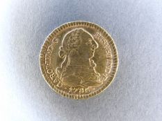 A 1785 gold Spanish Escudo bust of Charles III 3.