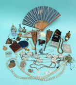 A netsuke, a white metal box, two inlaid Japanese Shibayama napkin rings, beads, compacts,