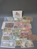 An amateur collection of world bank notes together with a Commonwealth Games commemorative £2 coin