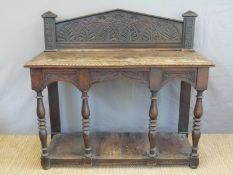A 19th century carved oak buffet with undershelf W142 x D56 x H130cm