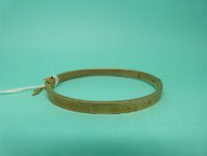 A 9ct gold bangle, weight 6.