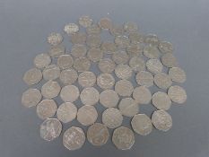Fifty-six collectable fifty pence pieces to include Olympic Games, Victoria Cross, Peter Rabbit,