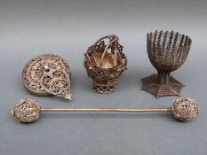 A white metal wirework basket, wirework egg cup,