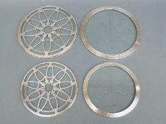 Four hallmarked silver and glass coasters, all Birmingham circa 1930's, largest 15.