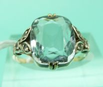 A 9ct gold ring set with a cushion cut aquamarine and diamonds in a white metal setting (Size K)