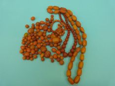 A graduated amber necklace made up of barrel shaped beads other amber beads etc