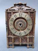 Early to mid 20th century lantern style clock in carved wooden brass bound case,