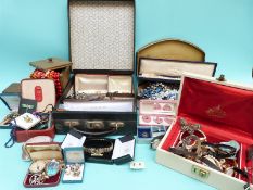 A collection of costume jewellery to include beads, bangles, brooches, brass box,