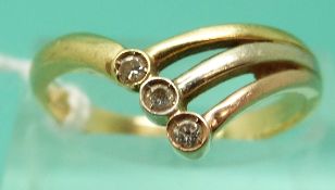 An 18ct gold ring set with three diamonds in a wishbone design (Size P)