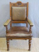 Oddfellows upholstered oak armchair with embossed hand and heart to back