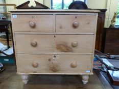 A small pine chest of two over two drawers,