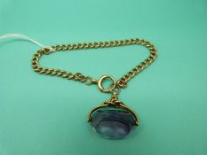 An 18ct gold bracelet with a 9ct gold amethyst swivel fob, 27.8g.