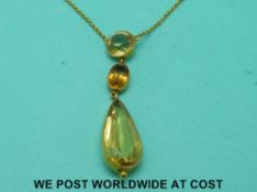 A yellow metal necklace marked 9ct gold set with pear cut,
