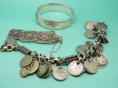 A hallmarked silver bangle, silver charm bracelet,