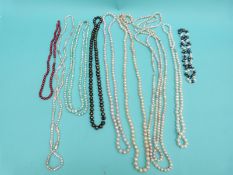 Nine pearl necklaces including freshwater pearls in different colours,