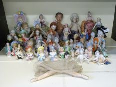 A collection of half dolls with gilt framed case