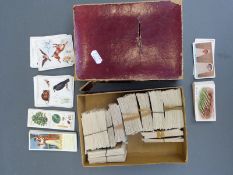 A collection of cigarette cards including Players and Wills