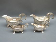 Two pairs of silver plated sauce boats with hoof feet.