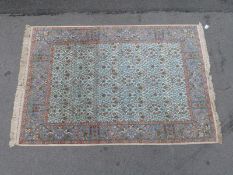 A beige and blue ground rug,