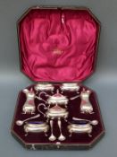 A cased Edward VII hallmarked silver eight piece cruet set comprising two peppers,