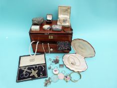 A silver bracelet, a silver ring set with pressed amber, three other silver rings,