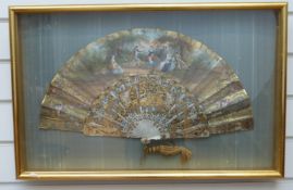 A 19thC hand painted carved mother of pearl and gilt fan in glazed case,