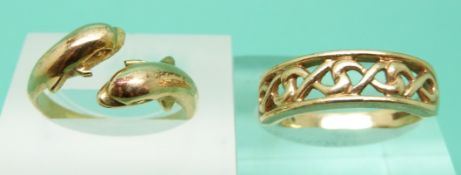 A 9ct gold ring in a Celtic design and a yellow metal ring in the form of two dolphins, weight 5.