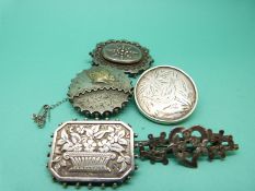 Five Victorian silver/white metal brooches.