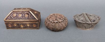 Two white metal filigree pots and a white metal casket with filigree and gilt decoration,