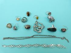 Nine silver/ white metal rings set with amber, turquoise,