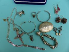A Victorian silver bracelet, silver bangles, a silver cross set with a ruby,