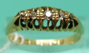 An 18ct gold ring set with five diamonds,