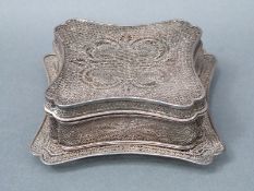 A white metal 19thC filigree lidded pot on stand, with finely pierced design, weight 153g, width 11.