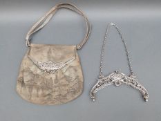 A white metal bag mount marked sterling,