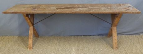 A pitch pine tavern table with steel stretchers,