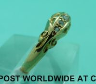 An 18ct gold ring set with five diamonds (size O)