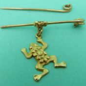A yellow metal brooch marked 14k in the form of a frog