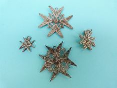 Two white metal filigree pendants in the form of a Maltese cross one with sphere decoration and two