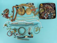 A quantity of costume jewellery to include beads, earrings,