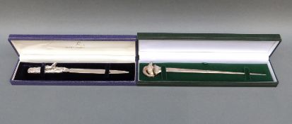 A cased modern hallmarked silver letter opener with bird to top (69g) together with a hallmarked