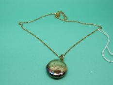 A Victorian yellow metal locket on a yellow metal chain, weight 7.