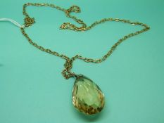 A 9ct gold chain made up of elongated links, weight 11g, and a briolette cut citrine pendant.