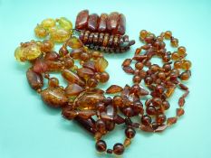 Four pressed amber beaded necklaces,