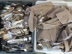 A large quantity of loose cutlery including some in wraps