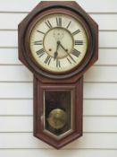 An Ansonia American wall clock with Roman numerals, seconds dial,